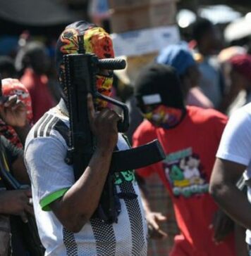 Haiti armed gang with faces covered.