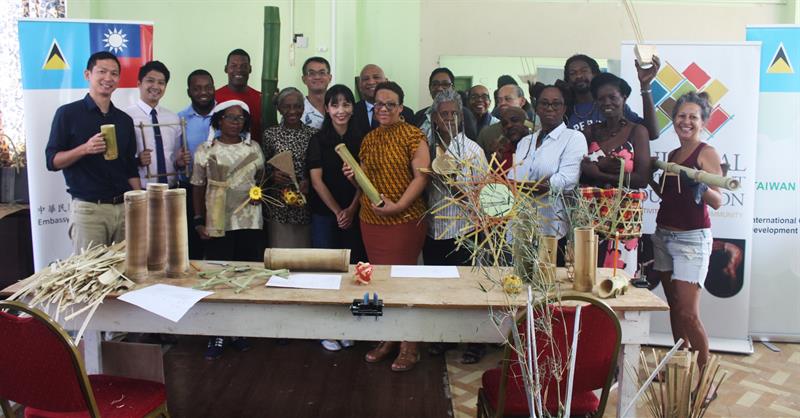 Attendees at Bamboo Works training workshop pose with their creations.