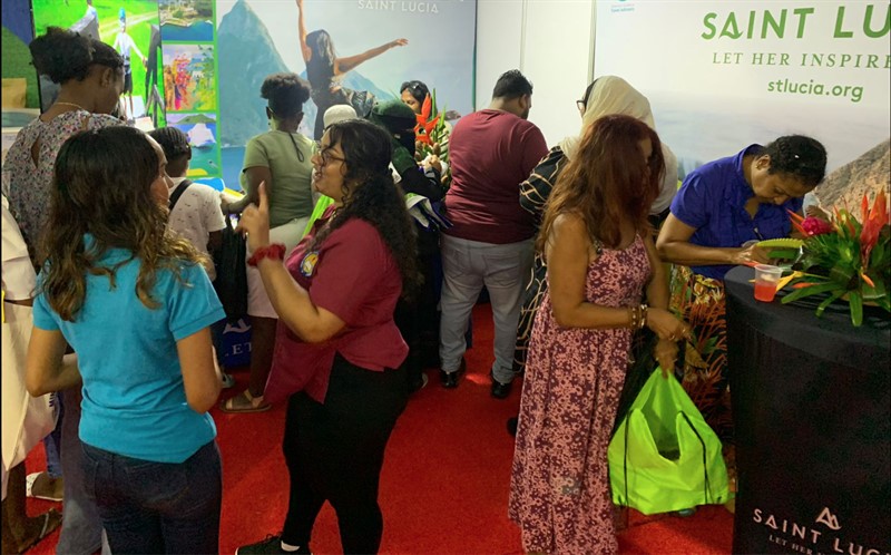 People at Saint Lucia booth during GuyExpo 2023.
