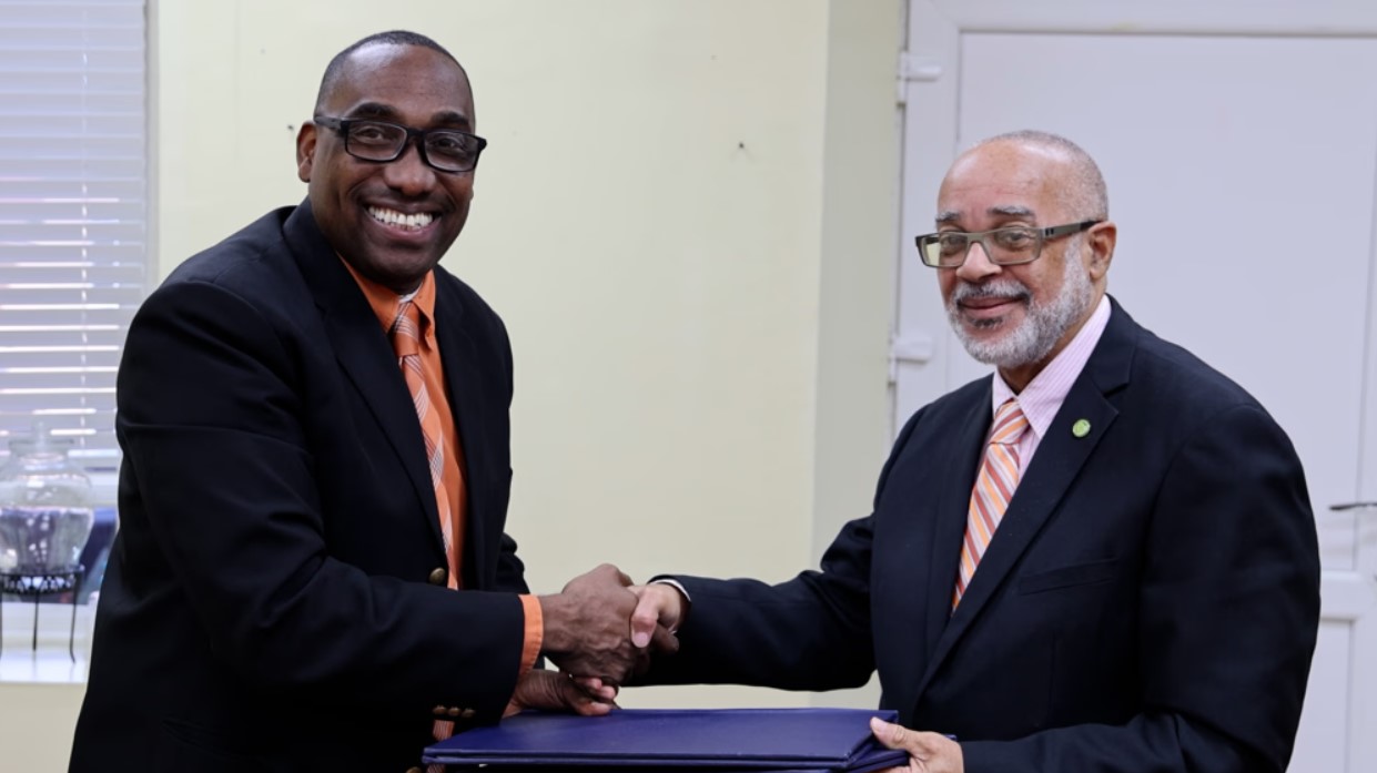 (Left to Right) Dr. Cletus Bertin & Dr. Didacus Jules shake hands after signing the MOU.