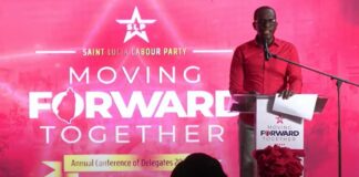 Philip J. Pierre stands at the podium as he addresses the delegates conference of his ruling Saint Lucia Labour Party at Babonneau.