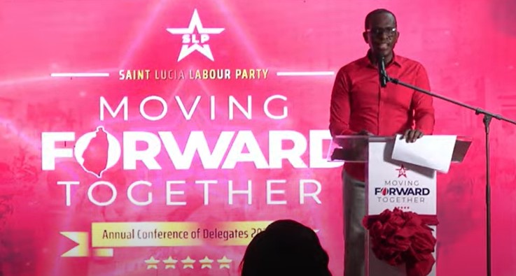 Philip J. Pierre stands at the podium as he addresses the delegates conference of his ruling Saint Lucia Labour Party at Babonneau.