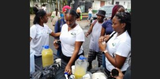 Sir Arthur Lewis Community College students feed the poor in Castries.
