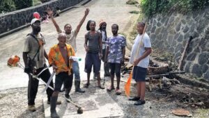 Soufriere residents participate in a community cleanup.