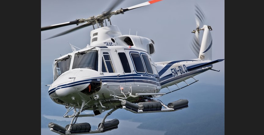 A Bell 412 helicopter in flight.