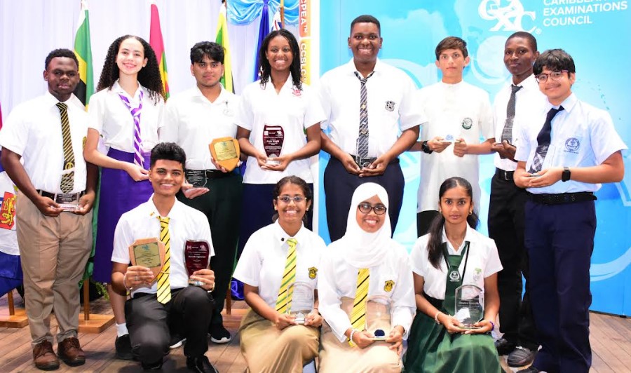 Top performers in the Caribbean Examinations Council CAPE exams pose with their awards.
