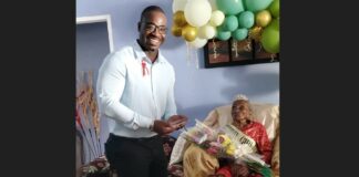 Gros Islet MP Kenson Casimir poses with the Island's newest centenarian.