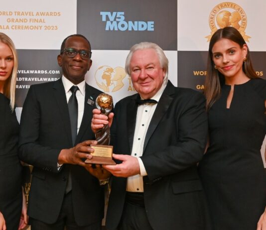 Philip J. Pierre accepts Saint Lucia's award of Best Honeymoon destination.