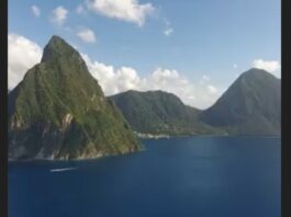 Pitons management area with the majestic twin mountain peaks appearing to rise out of the sea.