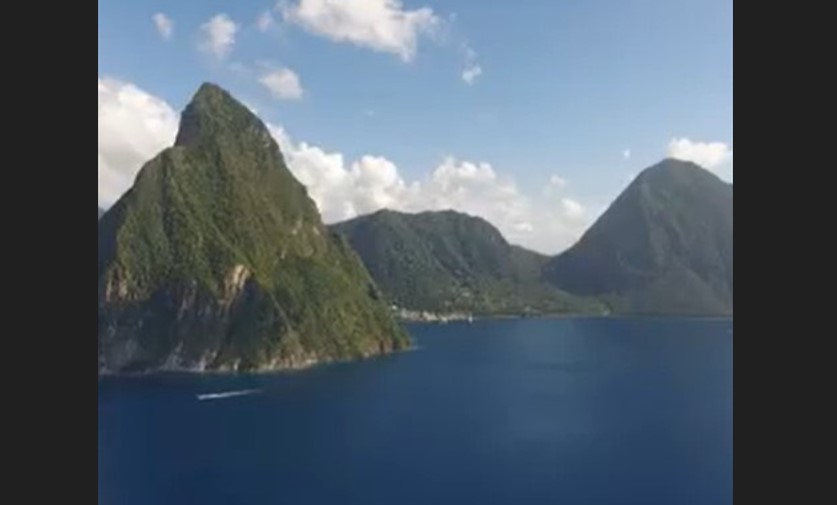 Pitons management area with the majestic twin mountain peaks appearing to rise out of the sea.