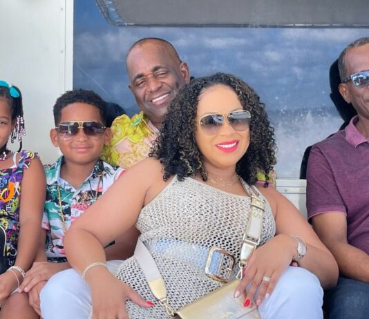 Dominica Prime Minister Roosevelt Skerrit and family on vacation in Saint Lucia pose for a photo with Saint Lucia's Prime Minister Philip J. Pierre.