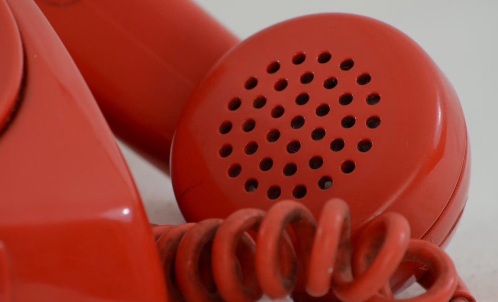Red conventional telephone set and receiver.