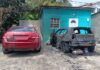Burnt out vehicles at Vieux Fort.