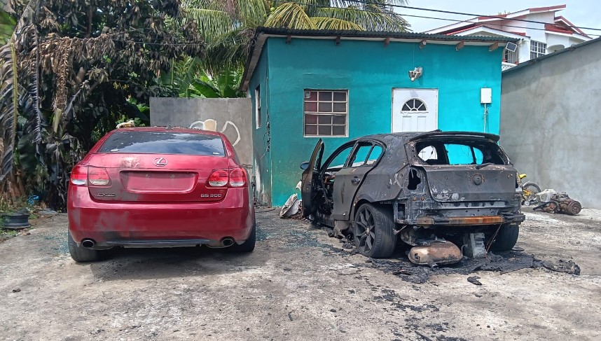 Burnt out vehicles at Vieux Fort.