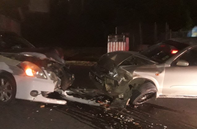 Mangled metal of two vehicles after head-on collision at Goodlands, Castries.