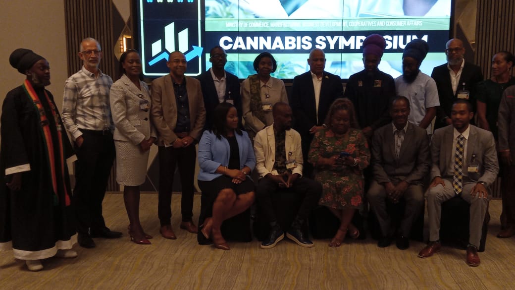 Cannabis symposium participants pose for photo.