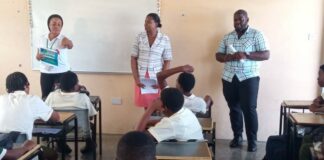 Police interact with students in classroom at the Ciceron Secondary School.