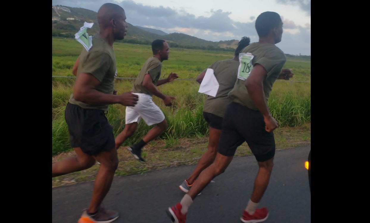 Participants on the run in police relay event.