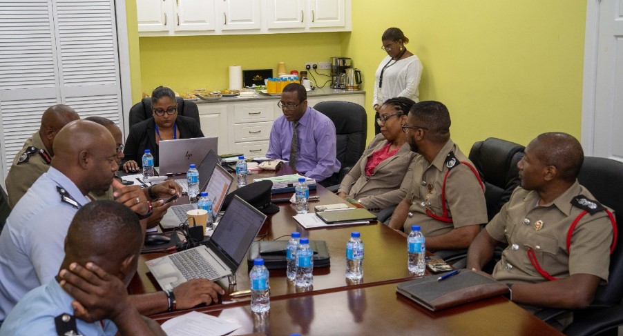 Participants sit around the table at Saint Lucia Fire Service legislation review meeting.