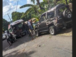 Damaged Suzuki Escudo and ambulance on the scene of Babonneau accident.