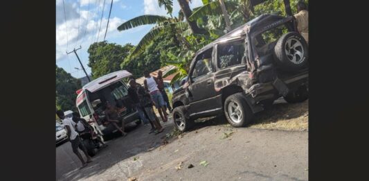 Damaged Suzuki Escudo and ambulance on the scene of Babonneau accident.