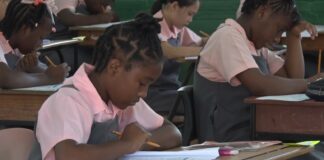 Students in classroom sit CPEA exam.