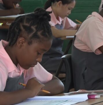 Students in classroom sit CPEA exam.