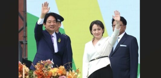 Taiwan's new President and Vice President wave to the crowd.