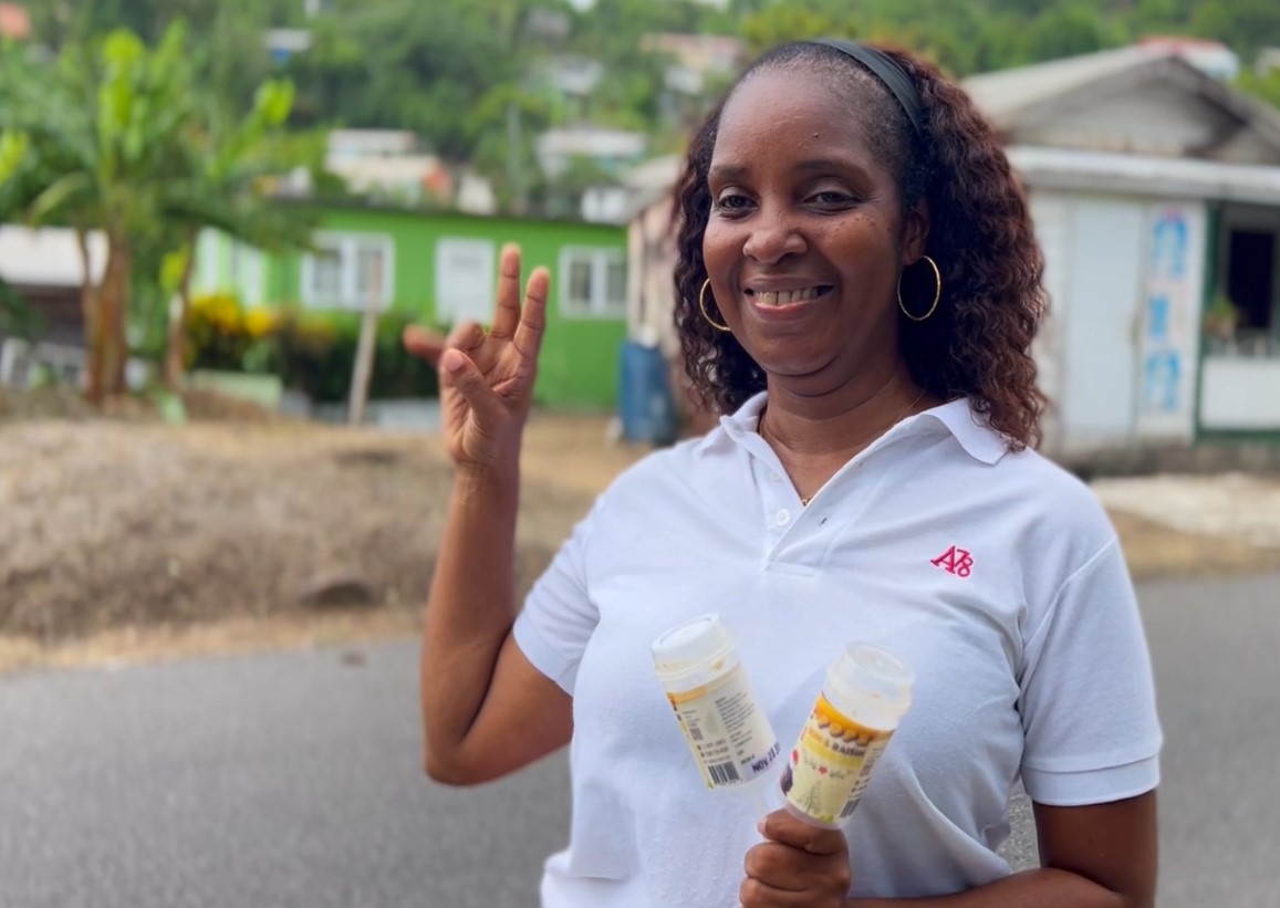 Small businesswoman shows off her product - ice lollies.