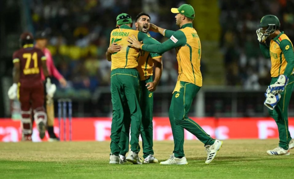 South African cricketers celebrate win.