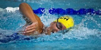 Competitive swimmer in pool.
