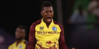 West Indies bowler celebrates after taking a wicket.