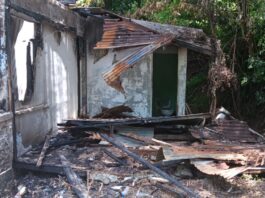 Partially destroyed house after fire at Bois Cachet.