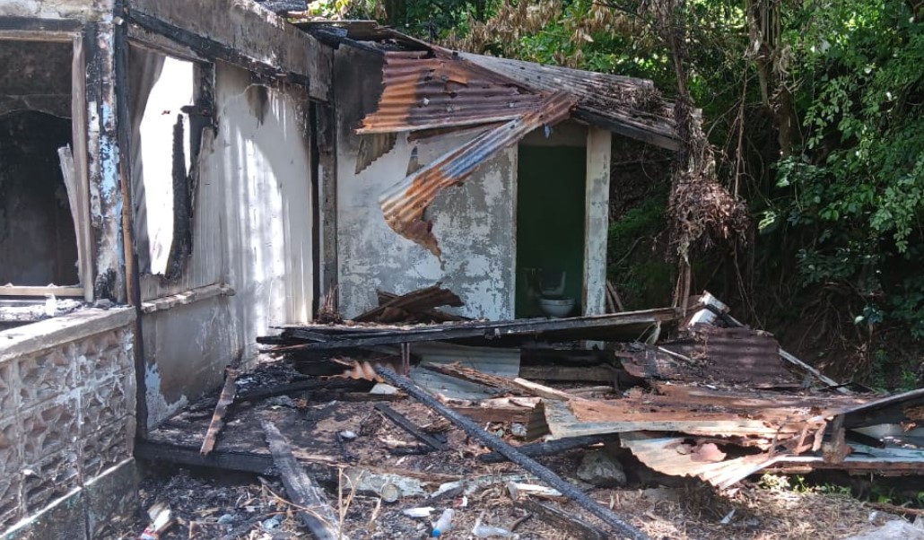 Partially destroyed house after fire at Bois Cachet.