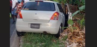 Vehicle ambushed at Dennery where two men were fatally shot.