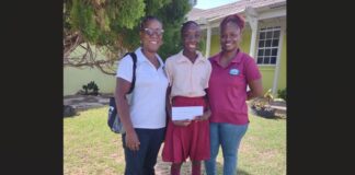 Lisa Franklin Joseph present cheque to student.