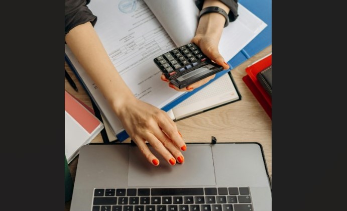 Woman with calculator