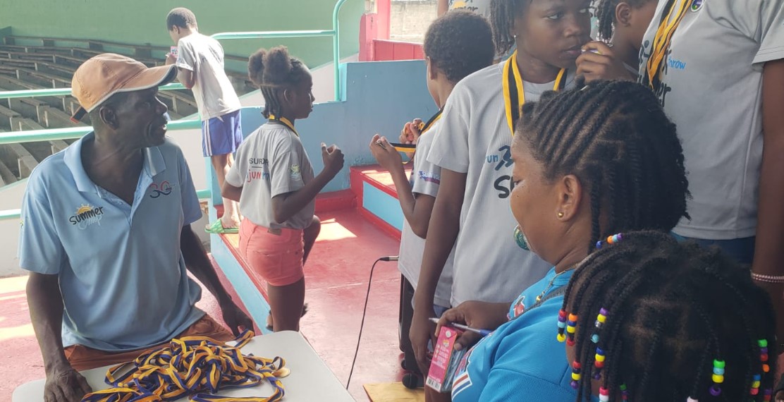 Cuthbert Modeste (Left) with summer camp attendees.