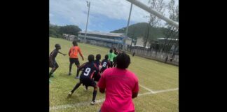Football action in police 'Kick Our Crime and Violence' initiative.