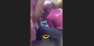 Emergency personnel tend to a biker on the ground after he collided with e vehicle at Praslin.