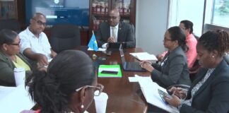 Education Minister Shawn Edward presides over a meeting with SLTU representatives.