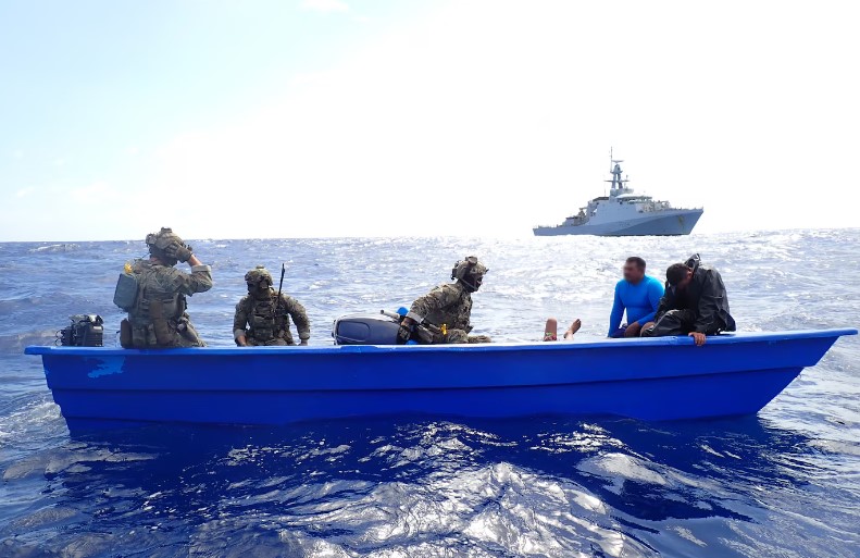 United States Coast Guard officials board drug smuggling vessel.