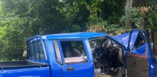 Mangled metal of Mitsubishi pickup after it ran off the road and collided with a tree at Desruisseaux.