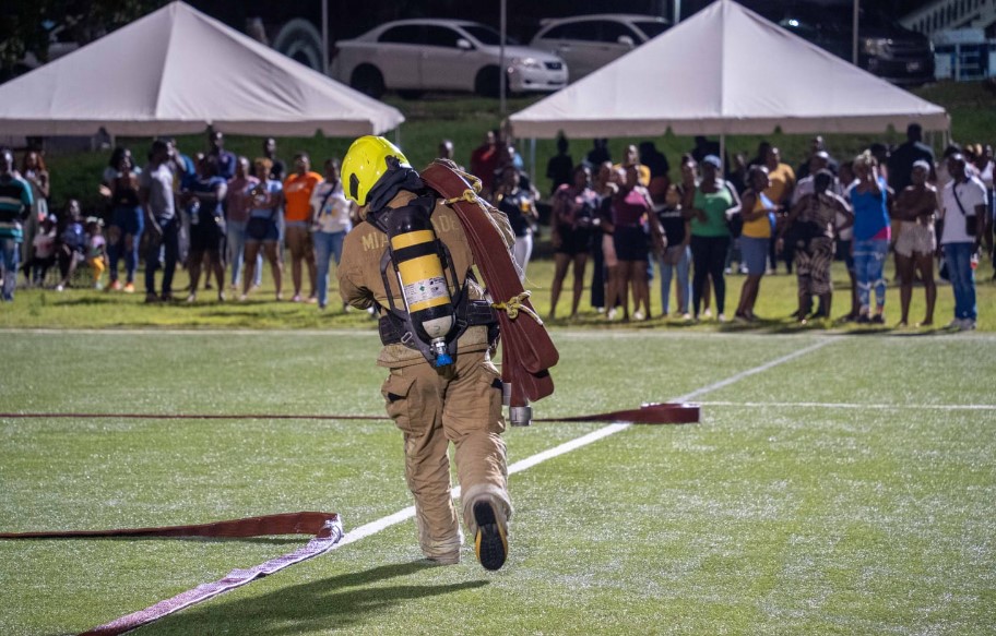 Firefighter participates in fire service challenge anniversary event.