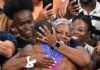 Noah Lyles mother embraces him.