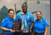 Daren Sammy and tourism officials with CPL trophy.