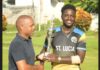 Kimani Melius (right) with Cricket Association president, Wayne Auguste.