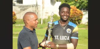 Kimani Melius (right) with Cricket Association president, Wayne Auguste.