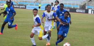 Saint Lucia youth footballers in action.