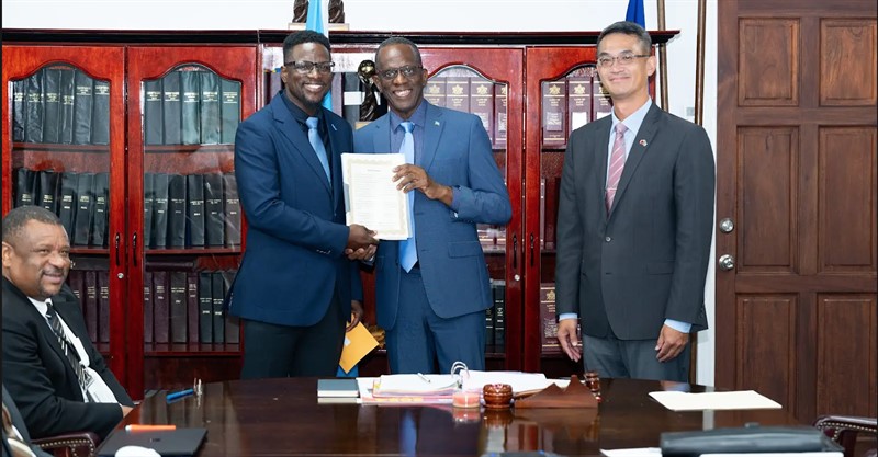 Prime Minister Philip J. Pierre receives Taiwanese grant funding cheque.